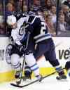 Jay LaPrete / The Associated Press
Jets grinder Chris Thorburn (left) battles the Blue Jackets' Ryan Murray, Monday night in Columbus.