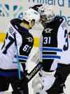 Gary Wiepert / The Associated Press
Winnipeg Jets' right winger Michael Frolik (67) and Ondrej Pavelec (34) celebrate a win over the Buffalo Sabres Wednesday in Buffalo, N.Y.  Winnipeg won 2-1.