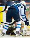 Liam Richards /  The Canadian Press
Bruins goalie Tuukka Rask stops a puck from Jets forward Bryan Little during first period NHL pre-season hockey action in Saskatoon on Friday.