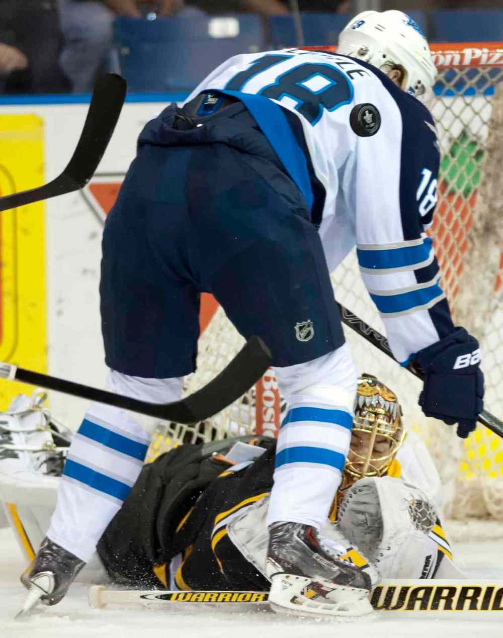 Liam Richards / The Canadian Press
Bruins goalie Tuukka Rask stops a puck from Jets forward Bryan Little during first period NHL pre-season hockey action in Saskatoon on Friday.