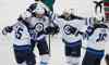 Ann Heisenfelt / The Associated Press
Winnipeg Jets centre Mark Scheifele (55), centre Mathieu Perreault, second from right, and left wing Andrew Ladd (16) celebrate with right wing Blake Wheeler (26) after Wheeler's first-period goal on Minnesota Wild goalie Devan Dubnyk.