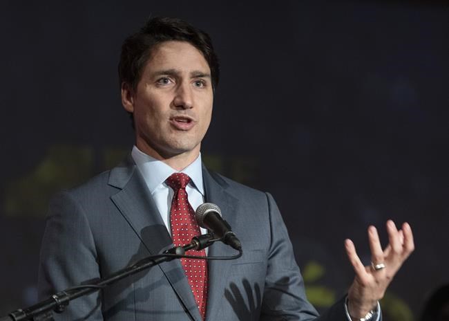 Prime Minister Justin Trudeau speaks at Saguenay Chambre of Commerce award gala, Thursday, April 4, 2019 in Saguenay, Que. Trudeau says his threat to sue Conservative Leader Andrew Scheer is about making sure there are consequences for lying in politics.THE CANADIAN PRESS/Jacques Boissinot