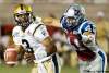 Graham Hughes / THE CANADIAN PRESS
Blue Bombers QB Steven Jyles (left) tries to escape from Montreal Alouettes defender Shea Emry during Thursday’s game. Jyles’ passing ability can give fans hope; his fumbles, however, provide a tough reality.
