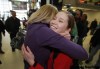 KEN GIGLIOTTI / WINNIPEG FREE PRESS
Team Canada skip Kaitlyn Lawes (right) gets a big hug from pal Kate Wagner Monday afternoon at James Richardson International Airport.