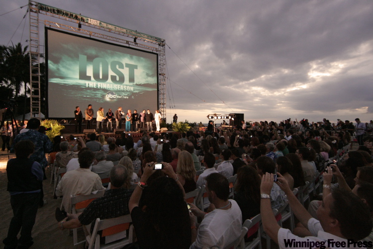 Marco Garcia / AP Photo
Beach goers are seen at the Lost Premiere on Waikiki Beach, Saturday, Jan. 30, 2010 in Honolulu. Lost, which is filmed in Hawaii, returns to television for its sixth and final season Tuesday.