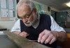 Steve Blasco, a Marine Geologist with Natural Resources Canada, looks over a seafloor sediment sample in Halifax, N.S., on Friday, March 23, 2012, similar to the ones he collected at site of the Titanic sinking. The tubes of mud allowed him to determine the reason why the 46,000 ton ship did not sink into the seafloor as expected, was because it was resting on the site of a marine landslide. THE CANADIAN PRESS/Mike Dembeck.