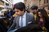 Former CBC host Jian Ghomeshi leaves court with his sister Jila, right, after signing a peace bond in Toronto, Wednesday, May 11, 2016. THE CANADIAN PRESS/Mark Blinch