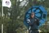 MATT DUNHAM / THE ASSOCIATED PRESS
Phil Mickelson of the U.S. takes shelter under an umbrella during heavy rainfall on the fourth green Friday in Wales.
