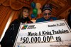 Mike Aporius / Winnipeg Free Press
$50-million Lotto Max winners Kirby and Marie Fontaine beam as they examine the oversized cheque they received at Winnipeg's Fort Garry Hotel this morning.