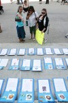 JOHN WOODS / The Canadian Press
Women look at the placards of slain and missing women in front of the Manitoba legislature in Winnipeg in August. People gathered at the legislature to call for a task force to look into the cases.