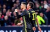 Juventus' Cristiano Ronaldo, left, celebrates after scoring his side's opening goal during the Champions League quarterfinal, first leg, soccer match between Ajax and Juventus at the Johan Cruyff ArenA in Amsterdam, Netherlands, Wednesday, April 10, 2019. (AP Photo/Martin Meissner)