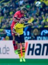 Leverkusen's Sven Bender, up, and Dortmund's Paco Alcacer challenge for the ball during the German Bundesliga soccer match between Borussia Dortmund and Bayer Leverkusen in Dortmund, Germany, Saturday Sept. 14, 2019. (AP Photo/Martin Meissner)