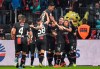 Leverkusen's Kevin Volland, 4th from right, is celebrated by his team after he scored his side's second goal during the German Bundesliga soccer match between Bayer 04 Leverkusen and FC Bayern Munich in Leverkusen, Germany, Saturday, Feb. 2, 2019. (AP Photo/Martin Meissner)