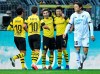 Dortmund's Raphael Guerreiro, center, celebrates after scoring his side's third goal during the German Bundesliga soccer match between Borussia Dortmund and TSG 1899 Hoffenheim in Dortmund, Germany, Saturday, Feb. 9, 2019. (AP Photo/Martin Meissner)