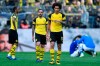 Dortmund's Axel Witsel and Dortmund's Paco Alcacer leave the pitch disappointed after losing the German Bundesliga soccer match between Borussia Dortmund and FC Schalke 04 in Dortmund, Germany, Saturday, April 27, 2019. Dortmund was defeated in the Derby by Schalke with 2-4. (AP Photo/Martin Meissner)