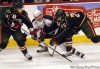 BORIS MINKEVICH/ Winnipeg Free Press
Manitoba Moose's  Mike Keane battles with two Houston  Aeros players during gplayoff game Monday night won 3-1 by the Moose. The Moose took the series4-2 to advance to the Calder Cup final.