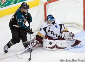 SEAN SIMMERS / The Patriot-News
Hershey Bears goalie Michal Neuvirth stops Manitoba Moose Mike Keane during the Moose 3-2 win in game 5 of the Calder Cup finals at Giant Center in Hershey. Game 6 is in Winnipeg Friday.