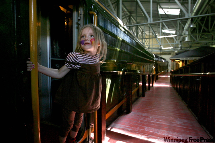 RUTH.BONNEVILLE@FREEPRESS.MB.CA
Isabella Monchamp, 3, climbs aboard the train at the Children's Museum in July during a family visit. The Children's Museum was named Best of the Road in Rand McNally's 2010 Road Atlas.