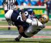 Frank Gunn / the canadian press
Toronto Argonauts running back Andre Durie (left) is tackled by Winnipeg Blue Bombers defensive back Jovon Johnson in Toronto on Sunday. The Argonauts defeated the Bombers 17-13.