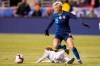 FILE - In this Feb. 27, 2019, file photo, United States' Megan Rapinoe, right, and Japan's Risa Shimizu, left, go after the ball during the first half of SheBelieves Cup soccer match in Chester, Pa. (AP Photo/Chris Szagola, File)