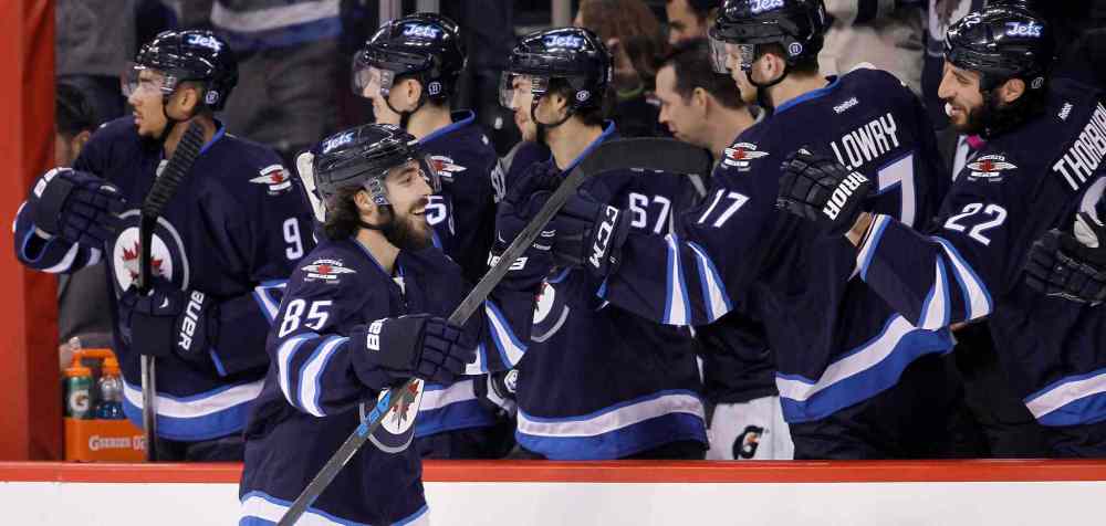 Trevor Hagan / The Canadian Press
Winnipeg Jets' Mathieu Perreault (85) celebrates his second goal of the first period against the Florida Panthers.