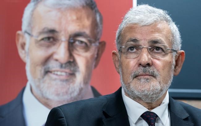 Imam Hassan Guillet, who has been dropped by the Liberal party as a candidate, listens to a question during a news conference in Montreal on Wednesday, September 4, 2019. THE CANADIAN PRESS/Paul Chiasson