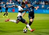 Vancouver Whitecaps forward Yordi Reyna kicks the ball away from Montreal Impact defender Jukka Raitala during first half MLS action in Montreal on Wednesday, August 28, 2019. THE CANADIAN PRESS/Paul Chiasson