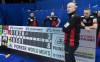 Canada skip Kevin Koe and Ted Appleman, B.J. Neufeld and Colton Flasch , rear left to right, are seen during the fifth end break in their game against Japan at the Men's World Curling Championship in Lethbridge, Alta. on Wednesday, April 3, 2019. THE CANADIAN PRESS/Paul Chiasson