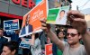 Supporters from various parties hold up campaign signs outside the studio of the first election debate in Toronto, on Thursday, Sept. 12, 2019. THE CANADIAN PRESS/Paul Chiasson