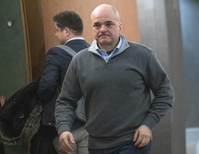 Former SNC-Lavalin vice-president Stephane Roy leaves a courtroom in Montreal on Wednesday, February 13, 2019. THE CANADIAN PRESS/Paul Chiasson