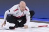 Canada skip Kevin Koe watches his shot as they face China at the Men's World Curling Championship in Lethbridge, Alta., on Sunday, March 31, 2019. THE CANADIAN PRESS/Paul Chiasson
