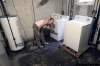 MIKE.DEAL@FREEPRESS.MB.CA
Roberta Jessamine indicates height of sewage backup in her basement. With such heavy rainfalls recently, many Manitobans are likely pulling out their insurance policies to check out their coverage.