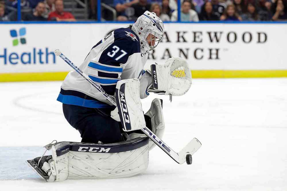 CHRIS O'MEARA / THE ASSOCIATED PRESS
Winnipeg Jets goaltender Connor Hellebuyck (37) makes a save on a shot by the Tampa Bay Lightning during the second period.