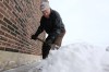 Trevor Hagan / Winnipeg Free Press
Bill Andrusiak, 80, shovels snow from the front of his hardware store at the corner of Aberdeen Avenue and Arlington Street on Sunday. His father opened Andrusiak Hardware in 1920.
