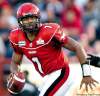 Jeff McIntosh / THE CANADIAN PRESS
Calgary Stampeders quarterback, Henry Burris rolls out during second quarter CFL football action in Calgary, Saturday.