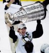 Nathan Denette / The Canadian Press
Pittsburgh Penguin Sidney Crosby holds up the Stanley Cup after defeating the Detroit Red Wings in Game 7 Stanley Cup Final hockey action in Detroit.