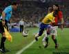 Julie Jacobson / The Associated Press
Assistant referee Hector Vergara of Canada, left, eyes the ball as Brazil's Ramires, center, is tackled by Portugal's Danny, right, during the World Cup group G soccer match between  Portugal and Brazil at the stadium in Durban, South Africa, Friday, June 25, 2010.