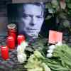 Michael Sohn / The Associated Press
Flowers and a portrait are placed in front of the apartment building where David Bowie once lived in Berlin, Germany, Monday, to honour the British musician. Bowie, the innovative and iconic singer whose illustrious career lasted five decades with hits like 