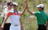 ADRIAN LAM / CANWEST NEWS SERVICE
Camilo Villegas (front) grins as Ian Poulter high-fives Mike Weir (right) at the conclusion of Tuesday’s Skins Game.