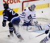 Winnipeg Jets' Chris Thorburn (22) puts the puck past Toronto Maple Leafs goaltender Jonas Gustavsson during first period NHL hockey action in Winnipeg, Tuesday, February 7, 2012. THE CANADIAN PRESS/Trevor Hagan