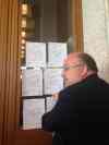 Kristin Annable / Winnipeg Free Press
Coun. Wyatt taping up all the amendments to the strategy that council refused to hear. Written on each paper is 