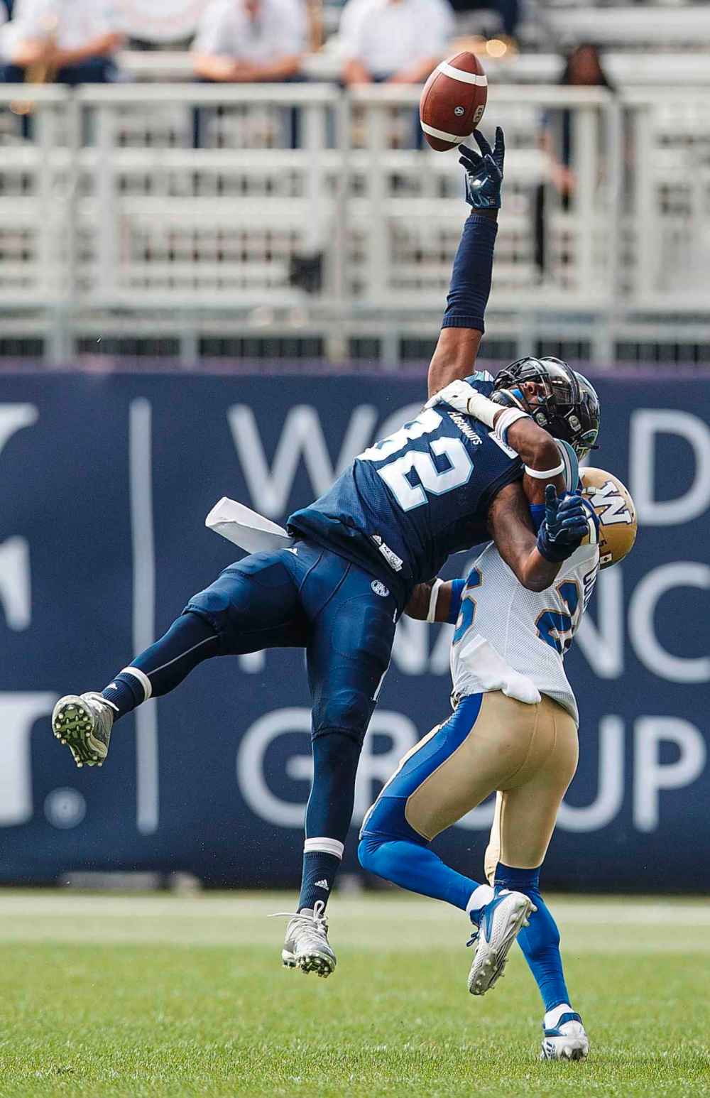 Toronto Argonauts' Malcolm Williams can't catch a pass while being defended by Winnipeg Blue Bombers' Tyneil Cooper during second half CFL football action in Toronto on Saturday, July 21, 2018.