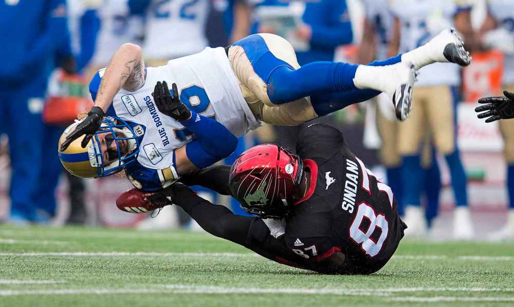 TODD KOROL / THE CANADIAN PRESS
Winnipeg Blue Bombers' Taylor Loffler, left, tackles Calgary Stampeders' Richard Sindani, during first half CFL West Final football action in Calgary, Sunday, Nov. 18, 2018.
