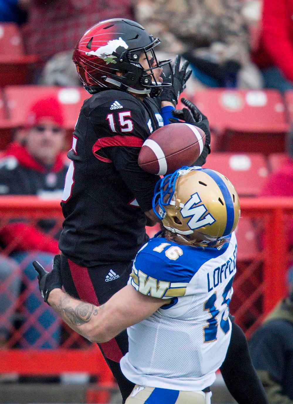 TODD KOROL / THE CANADIAN PRESS
Winnipeg Blue Bombers' Taylor Loffler, right, knocks a pass away from Calgary Stampeders' Eric Rogers, during first half CFL West final football action in Calgary, Sunday, Nov. 18, 2018.