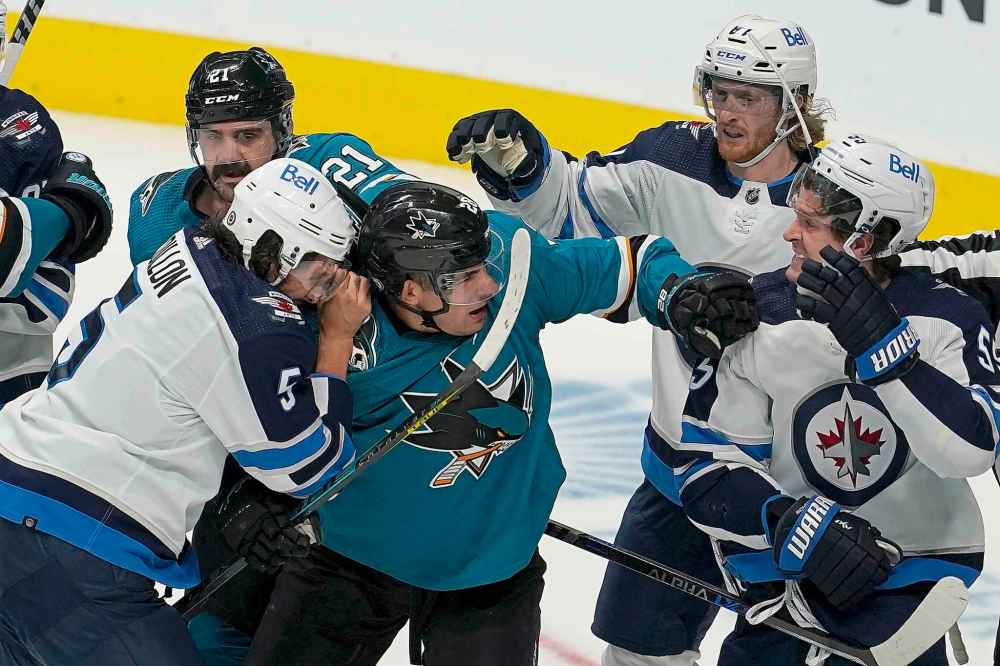 CP
San Jose Sharks' Timo Meier, center, and Jacob Middleton, top left, fight with Winnipeg Jets' Brenden Dillon, left, Kyle Connor, top right, and Mark Scheifele after a goal by Sharks' Rudolfs Balcers. (Jeff Chiu / The Associated Press)
