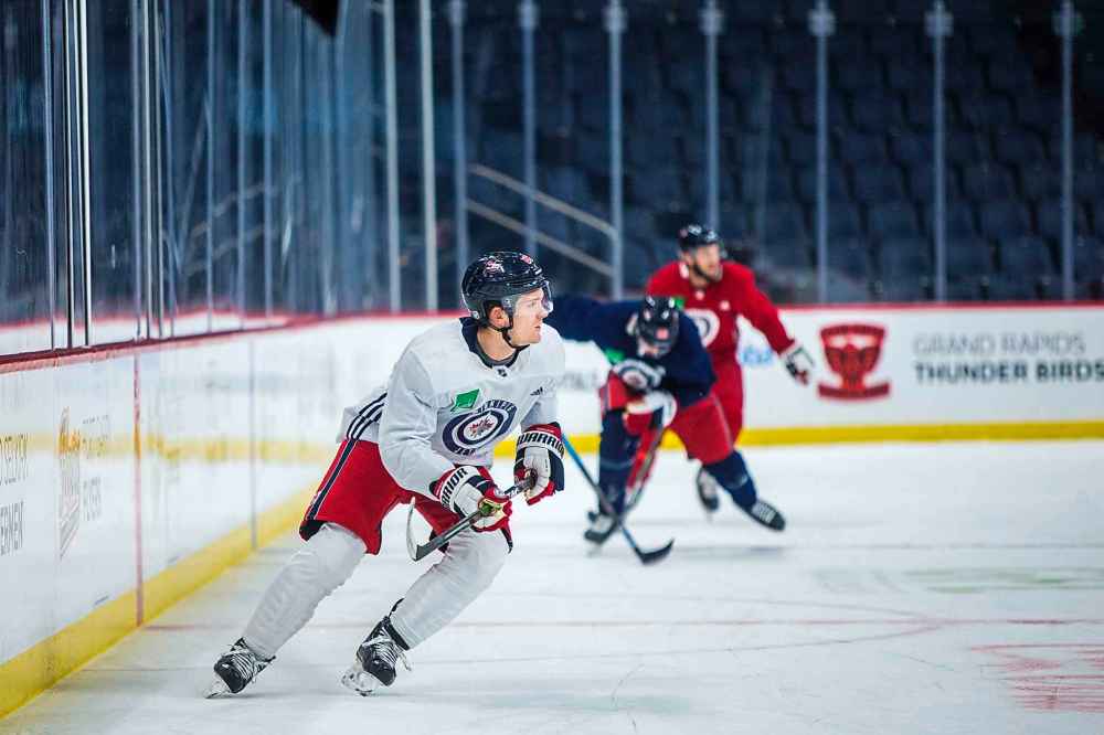 Jack Roslovic (28) at Jets practice at BellMTS Place in Winnipeg. Roslovic's transformation, from underused bottom-six forward to an all-round threat who looks at ease in a top-six role, has been dramatic. (Mikaela MacKenzie / Winnipeg Free Press)