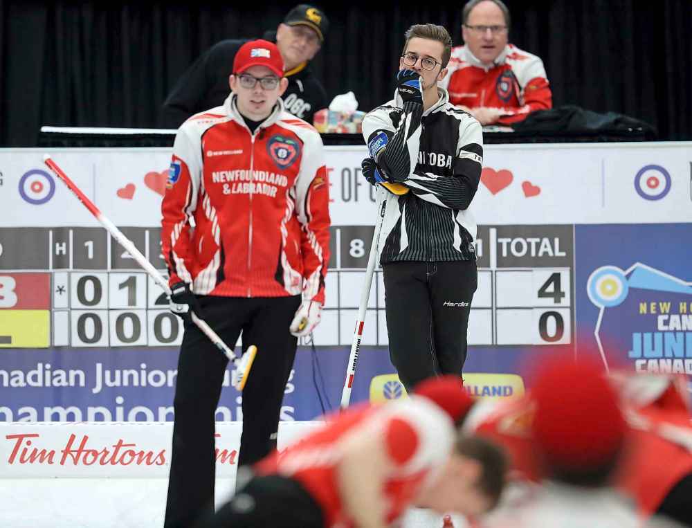 Team Manitoba's skip Jacques Gauthier looks on as Daniel Bruce, skip of team Newfoundland, instructs his sweepers, in the final. (TREVOR HAGAN / WINNIPEG FREE PRESS)