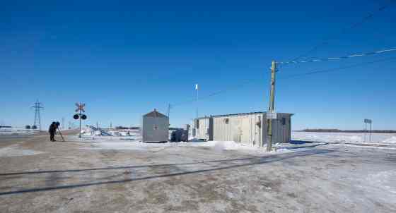 A smoking campfire is all that remains the day after protesters erected a blockade along the CN rail at Diamond, MB, yesterday.  (Mike Deal / Winnipeg Free Press)