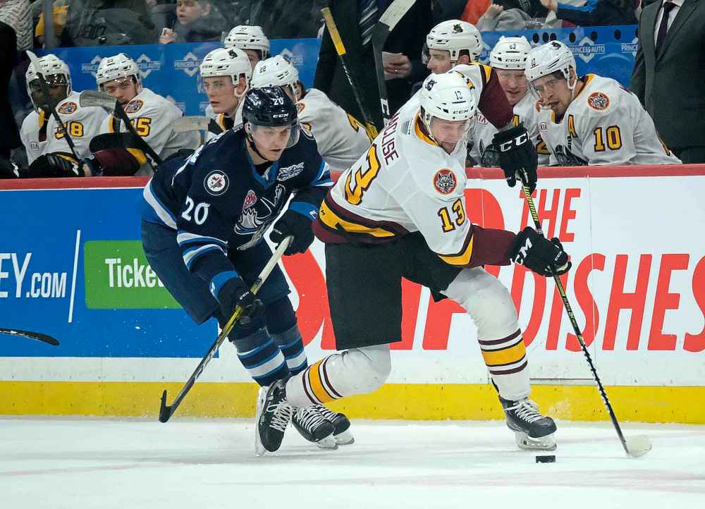 Kristian Reichel (left) had five goals and seven assists in 25 games with the Moose this season before making his NHL debut Sunday. (Phil Hossack / Winnipeg Free Press files)