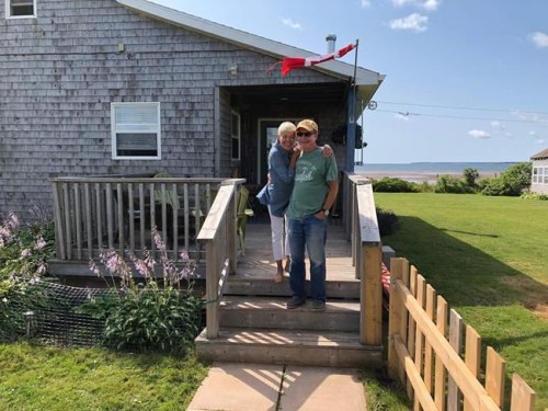Renee Huart-Field and her husband, Mike Field, are pictured outside their home in Little Pond, P.E.I., in this undated handout photo. A couple of years ago, Huart-Field and her husband packed up their lives in Bracebridge, Ont., in pursuit of the retirees' dream. And for a while, they were living it. But now, Huart-Field says she's among the many snowbirds whose cross-border lifestyles have been derailed by the COVID-19 pandemic. THE CANADIAN PRESS/HO - Guy Fortin